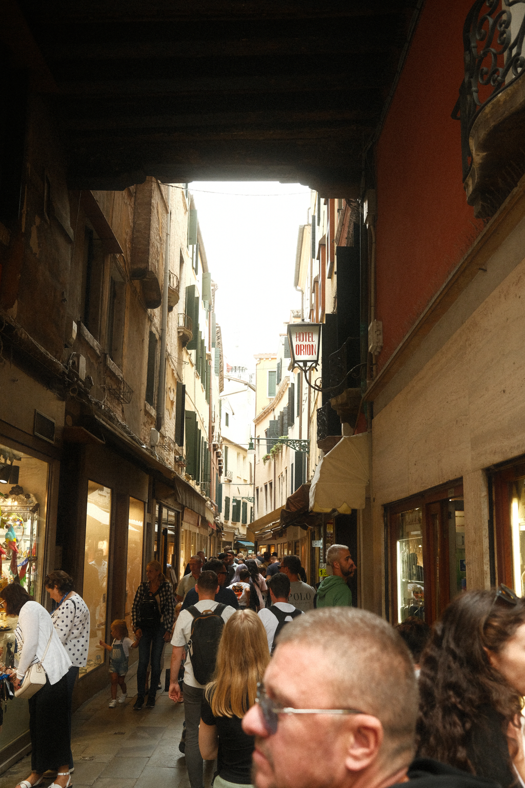 Looking down the busy street under the clock tower in San Marco's Square