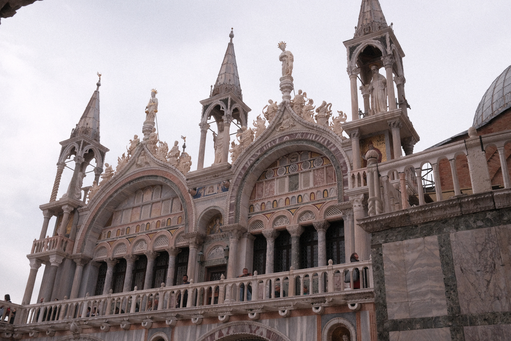 Southern face of the Basilica di San Marco, featuring elaborate marble work, gilded mosaics, and stained glass