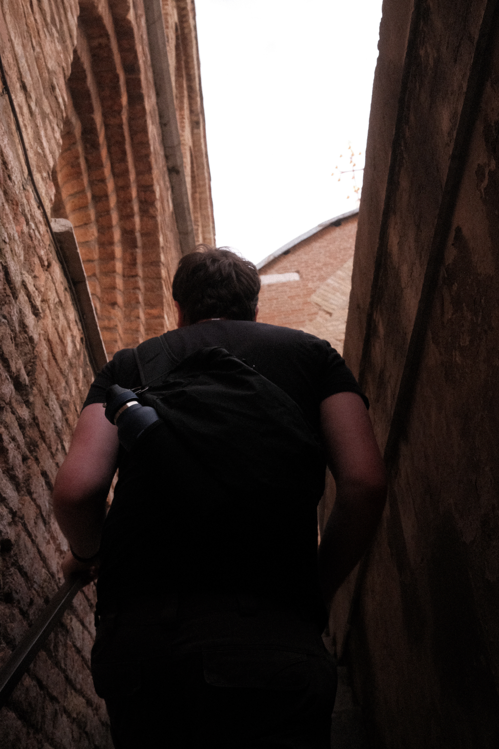 Nick climbing the stairs of an exterior balcony of the Doge's private quarters