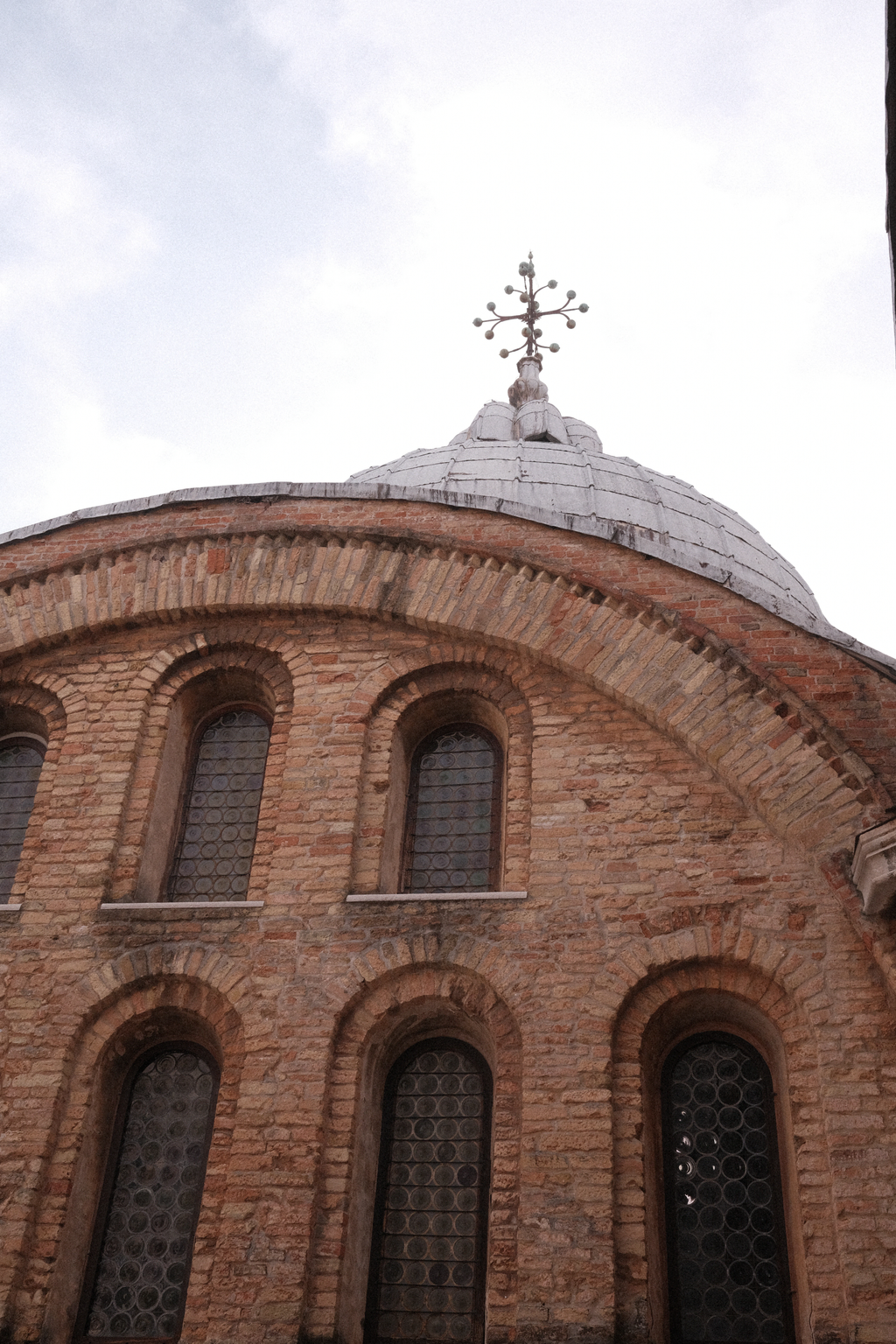 A pre-schism rooftop ornament of the cross atop a dome of the Basilica di San Marco