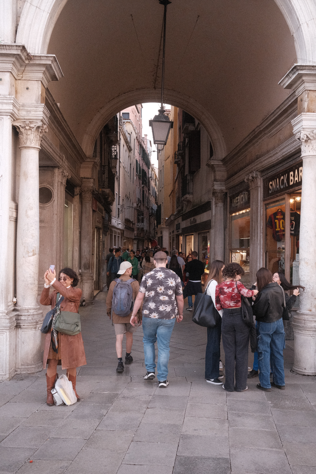 The archway underneath the clock tower of Venice, facing down the street