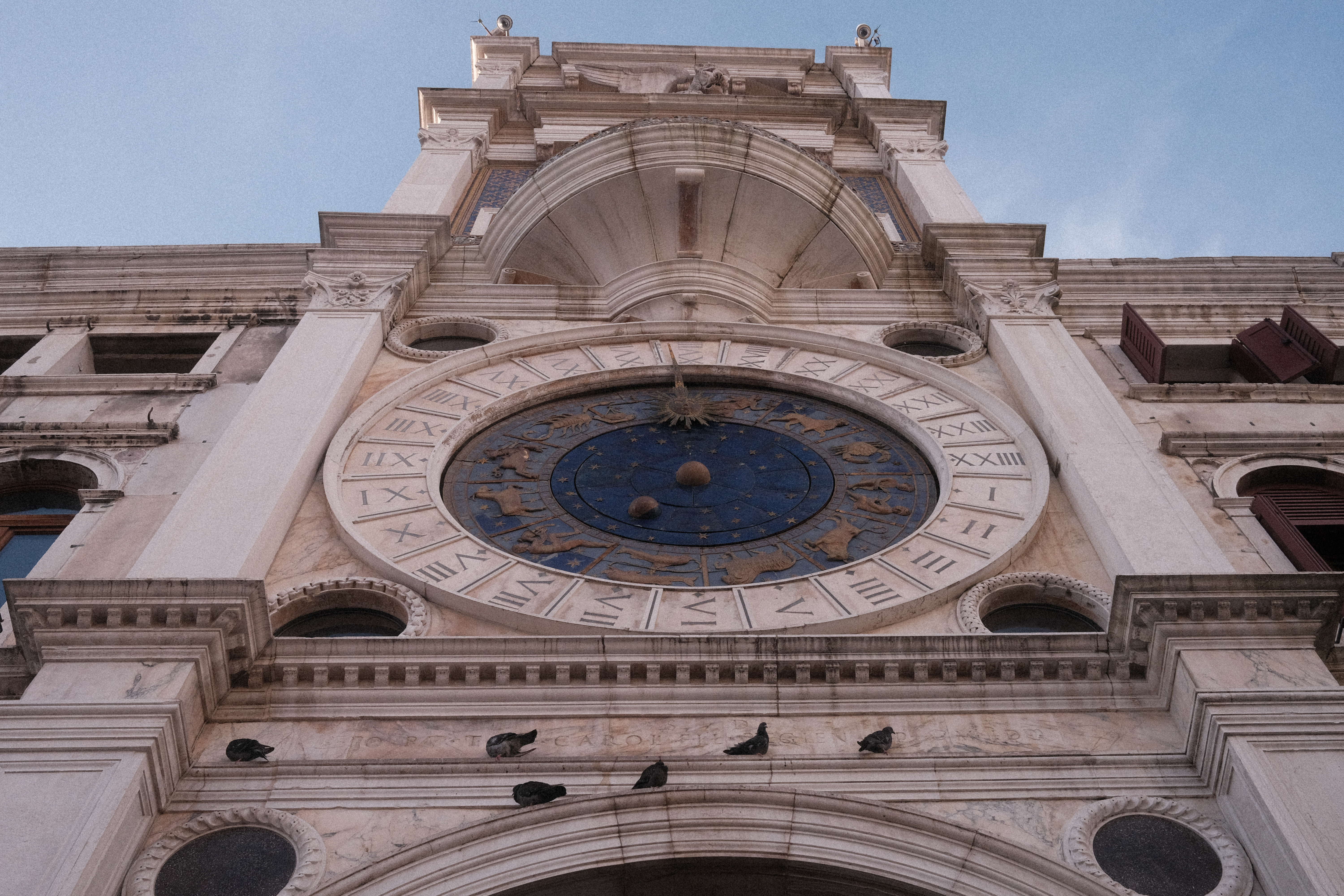 The face of the clock tower, denoting the time, month, and lunar phase