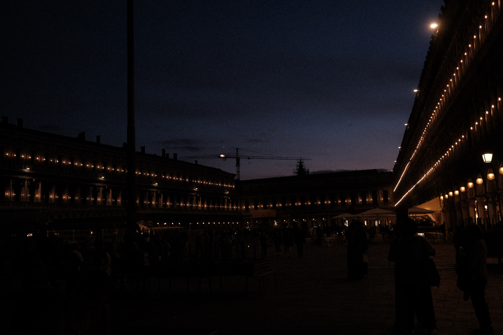 San Marco's Square at dusk, lit by many candles along its second story