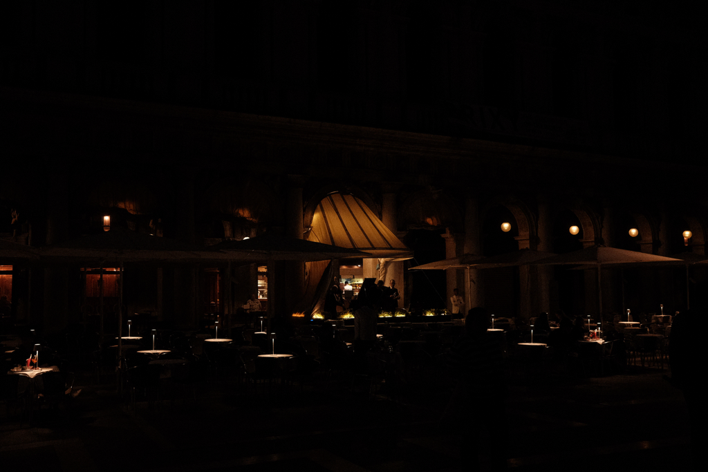 A band playing for evening patrons of a cafe in San Marco's Square