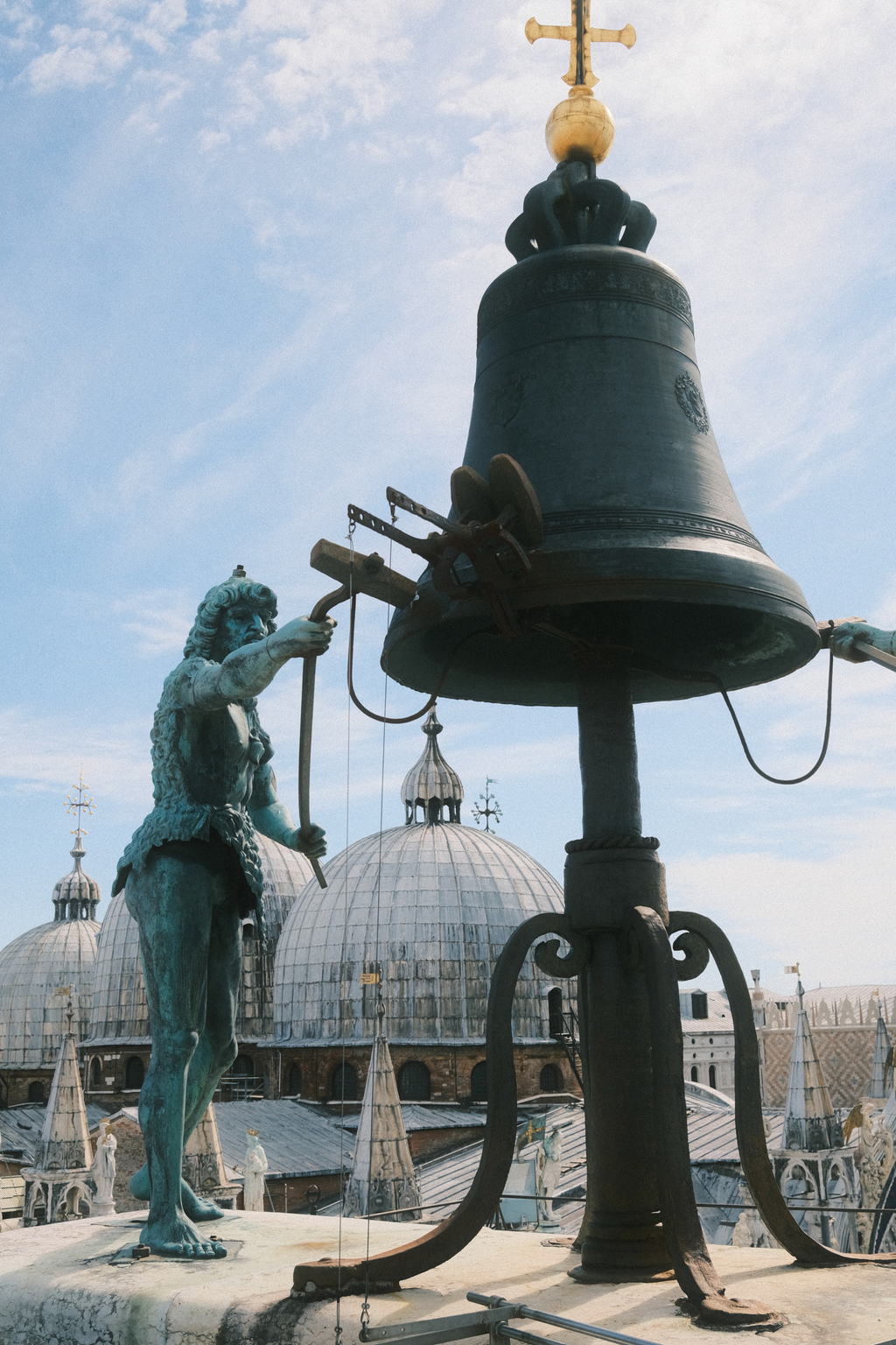 Statue of "the past" which strikes the clock tower's bell 2 minutes before the hour