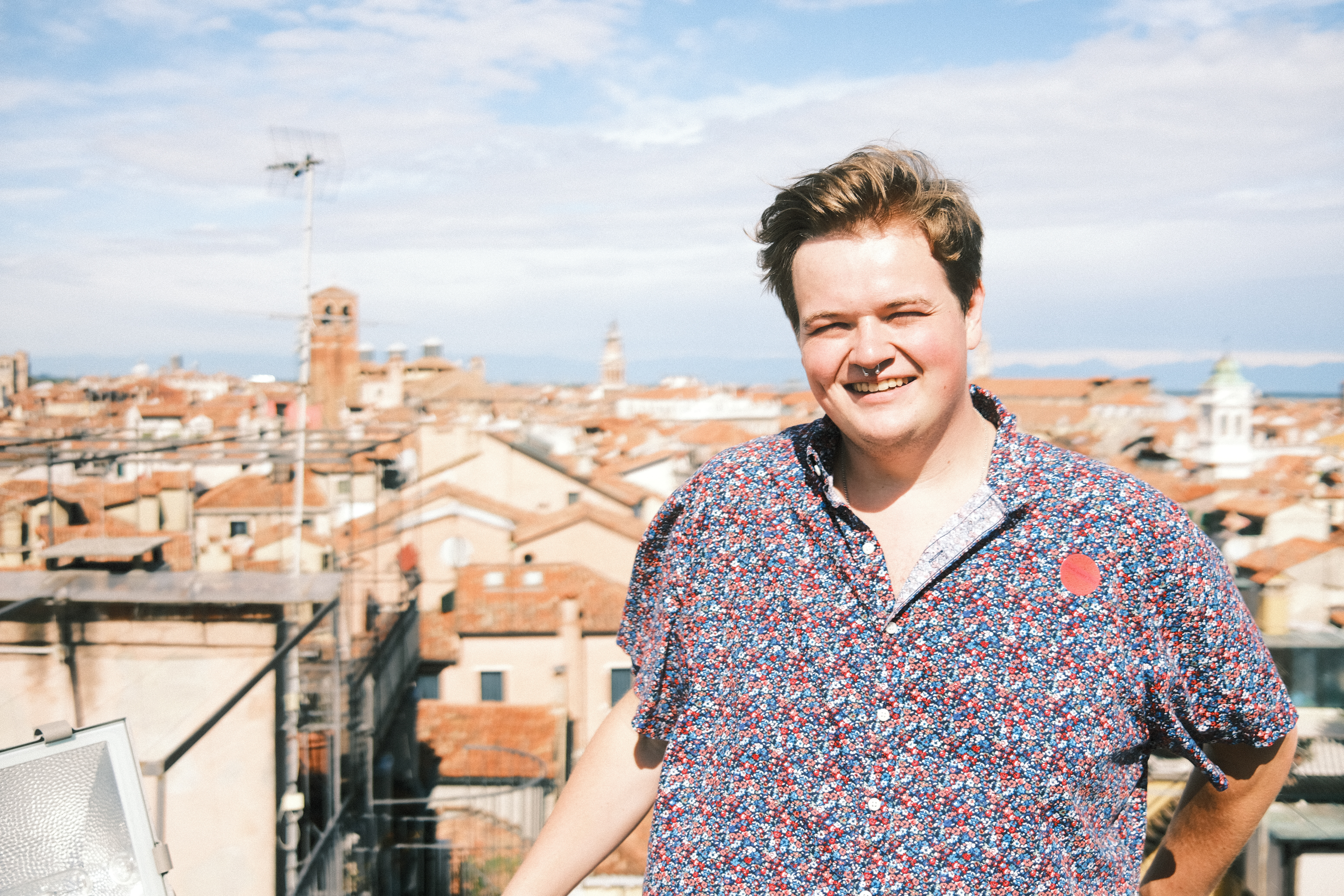 Sean with the backdrop of the Venician skyline as seen from atop the clock tower