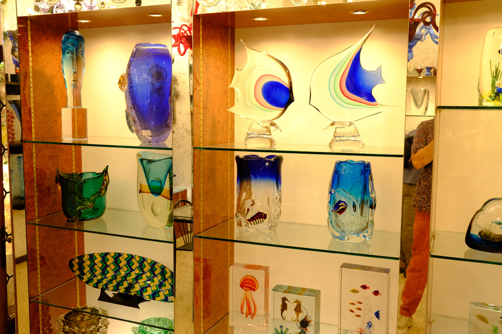 A variety of vases and sculptures on display in the glass factory