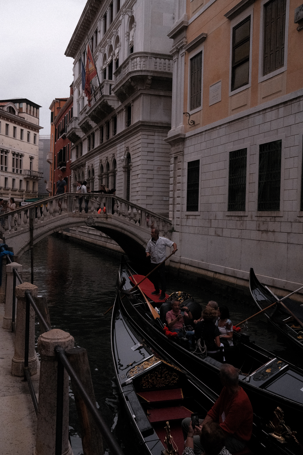 A gondola about to traverse under a bridge