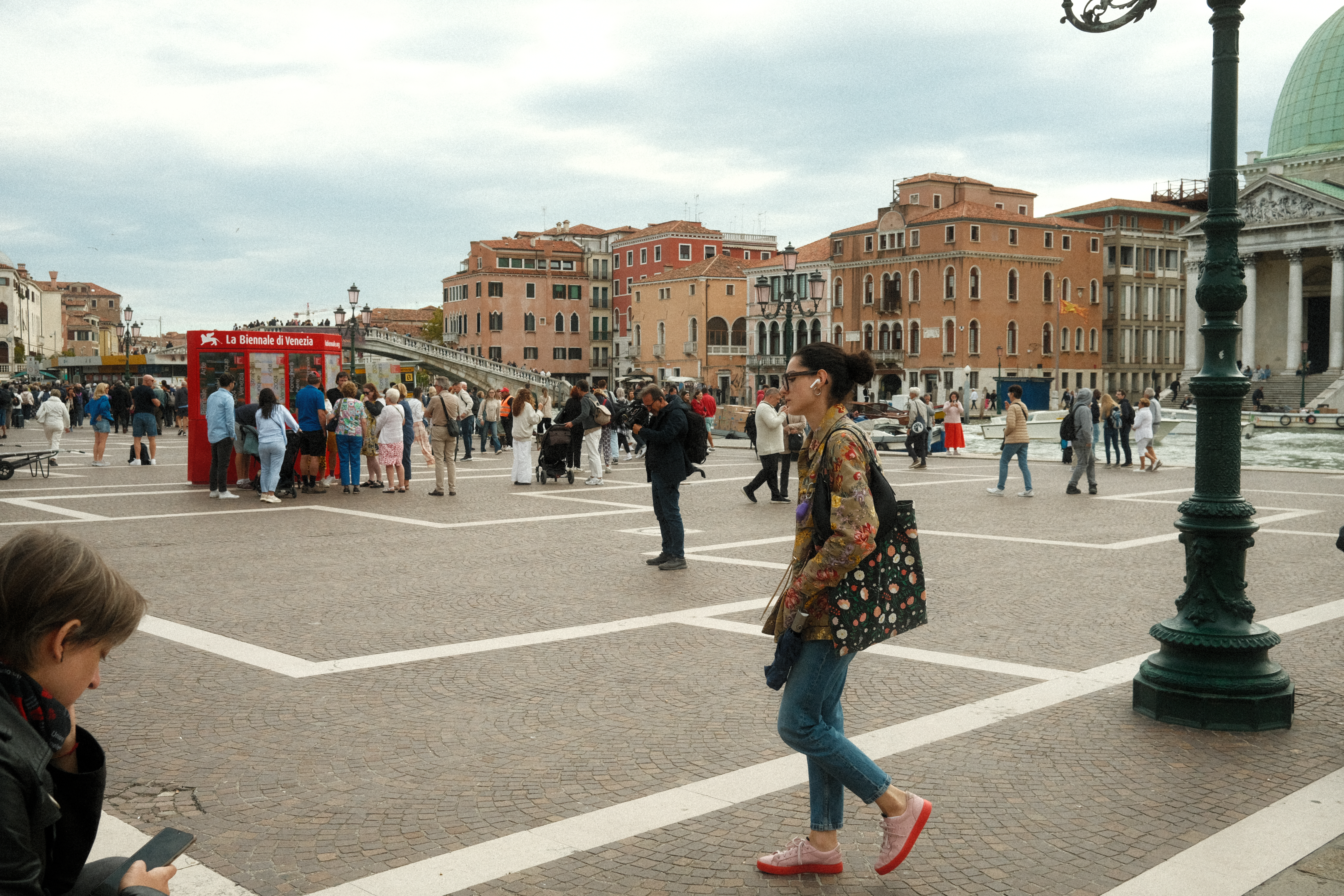 A woman walking on the way to Venice's train station