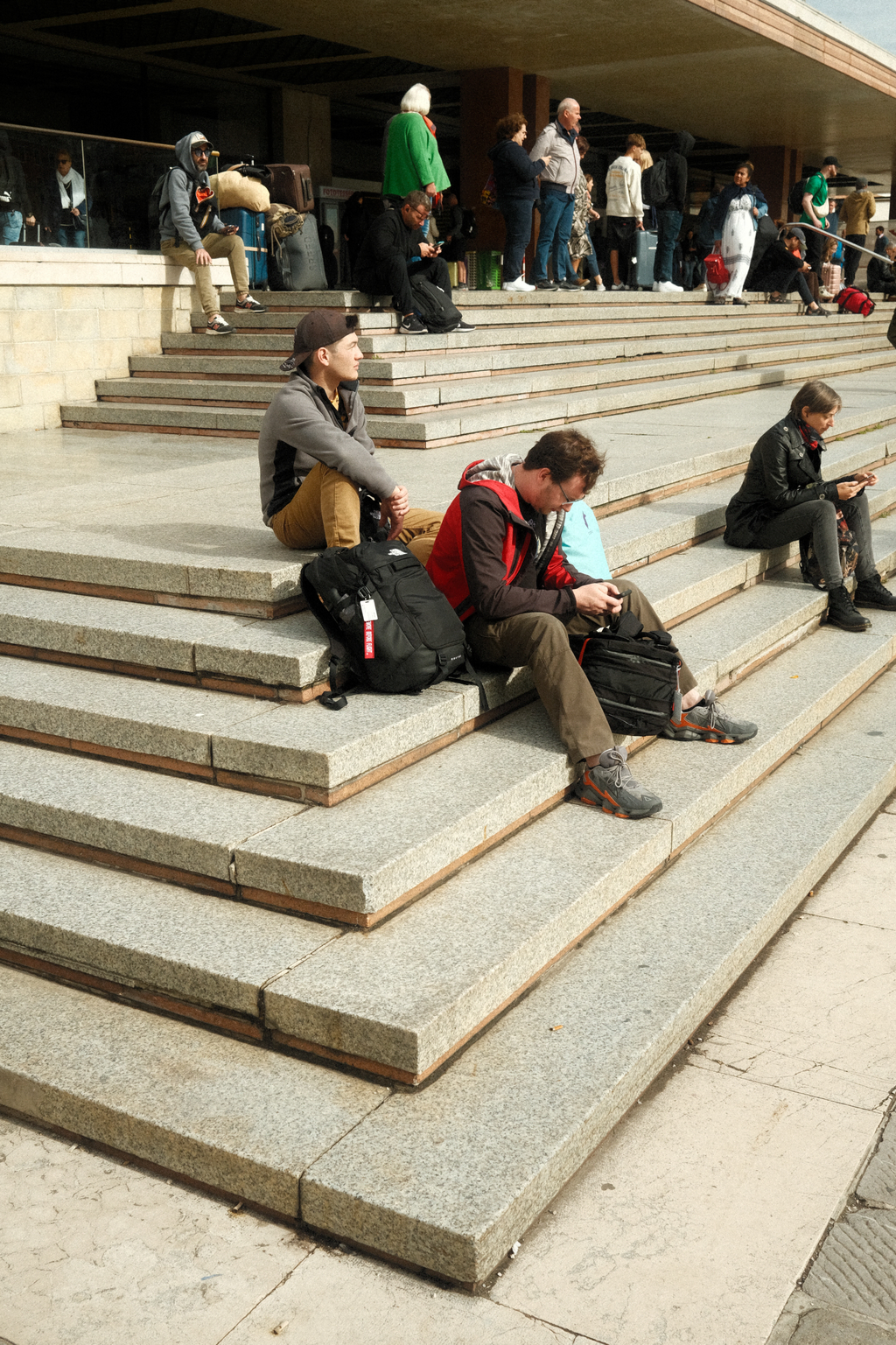 Nick & Tim waiting on the steps of the train station in Venice