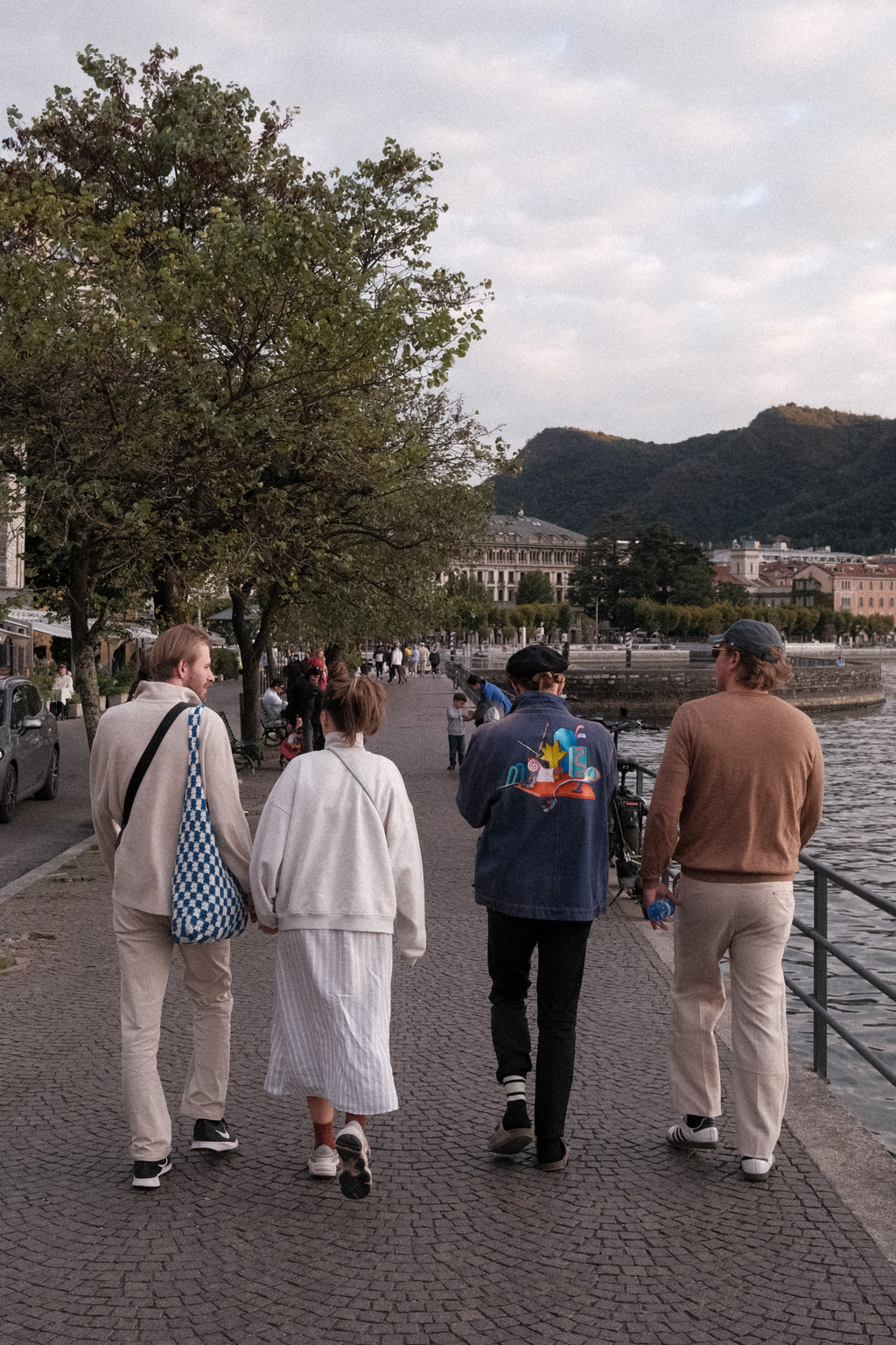 Group of four German tourists walking along the shore