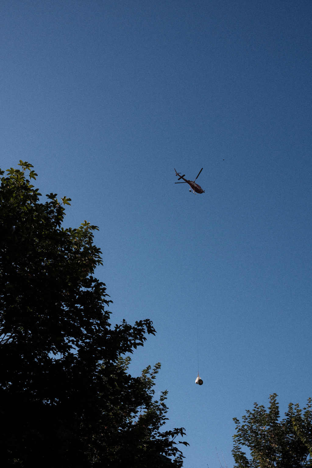 A helicopter delivering a package in the early morning