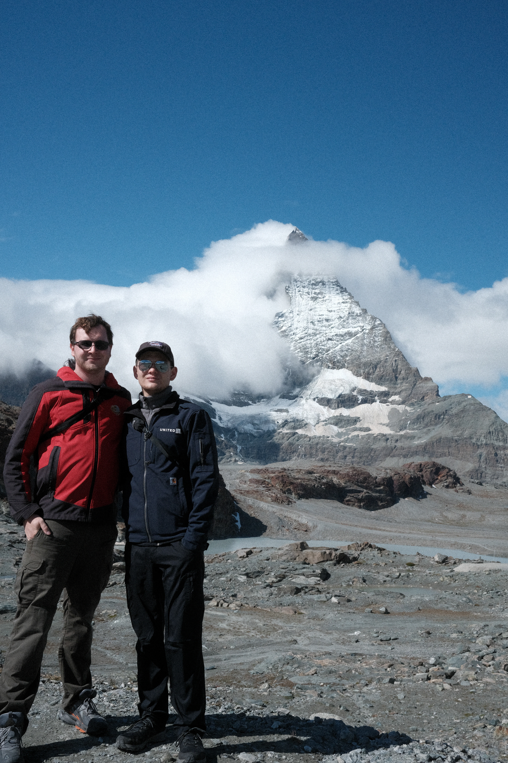 Nick & Tim on a rocky outcrop in front of the Matterhorn