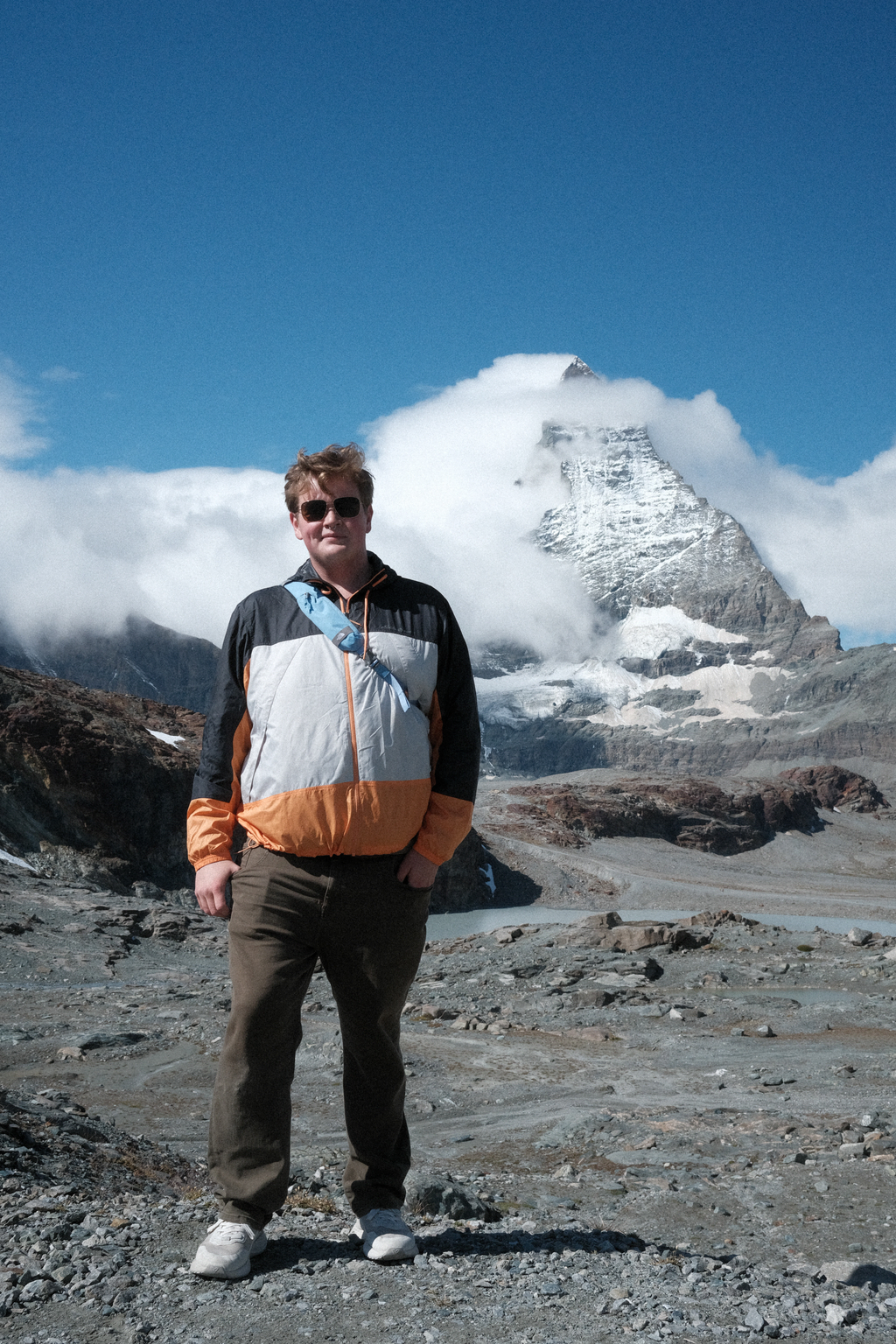 Sean on a rocky outcrop in front of the Matterhorn