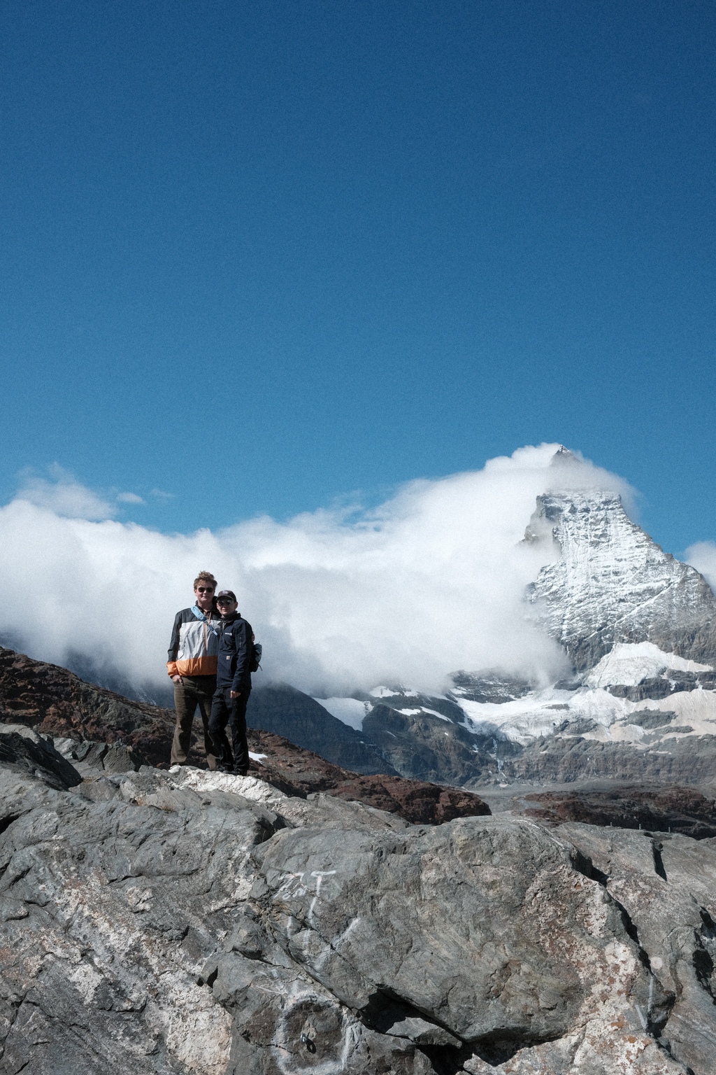 Sean & Tim on a rocky outcrop in front of the Matterhorn