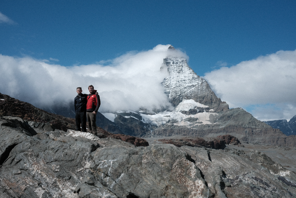 Nick & Tim on a rocky outcrop in front of the Matterhorn