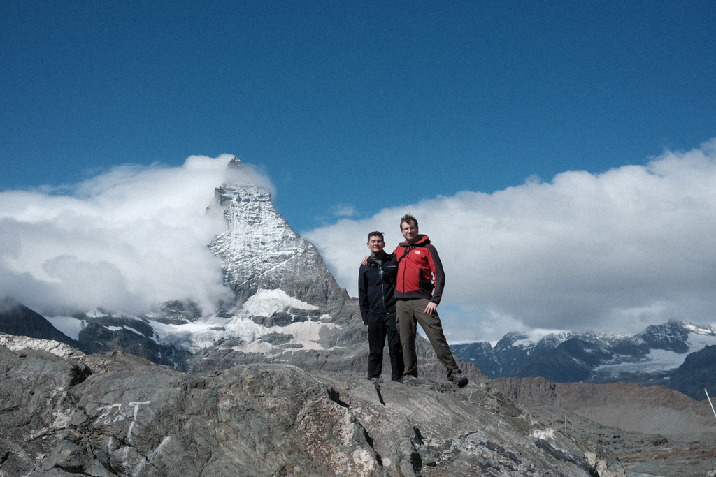 Nick & Tim on a rocky outcrop in front of the Matterhorn