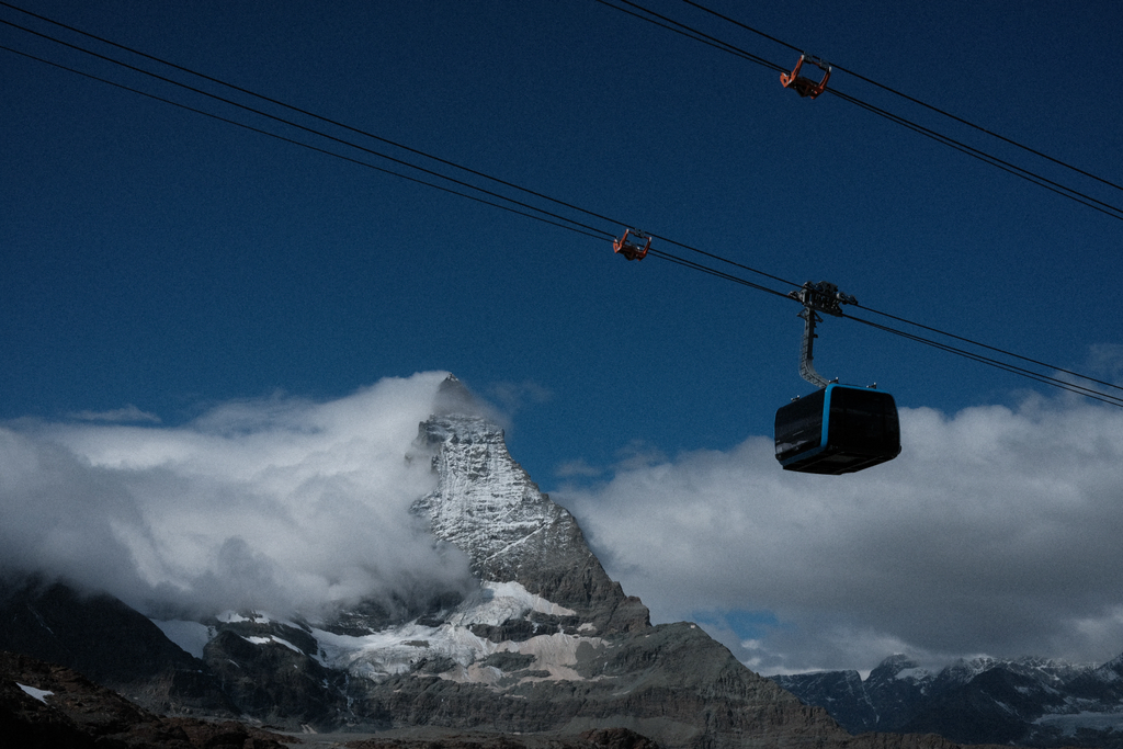 A gondola bound for Zermatt Glacier Paradise passing in front of the Matterhorn