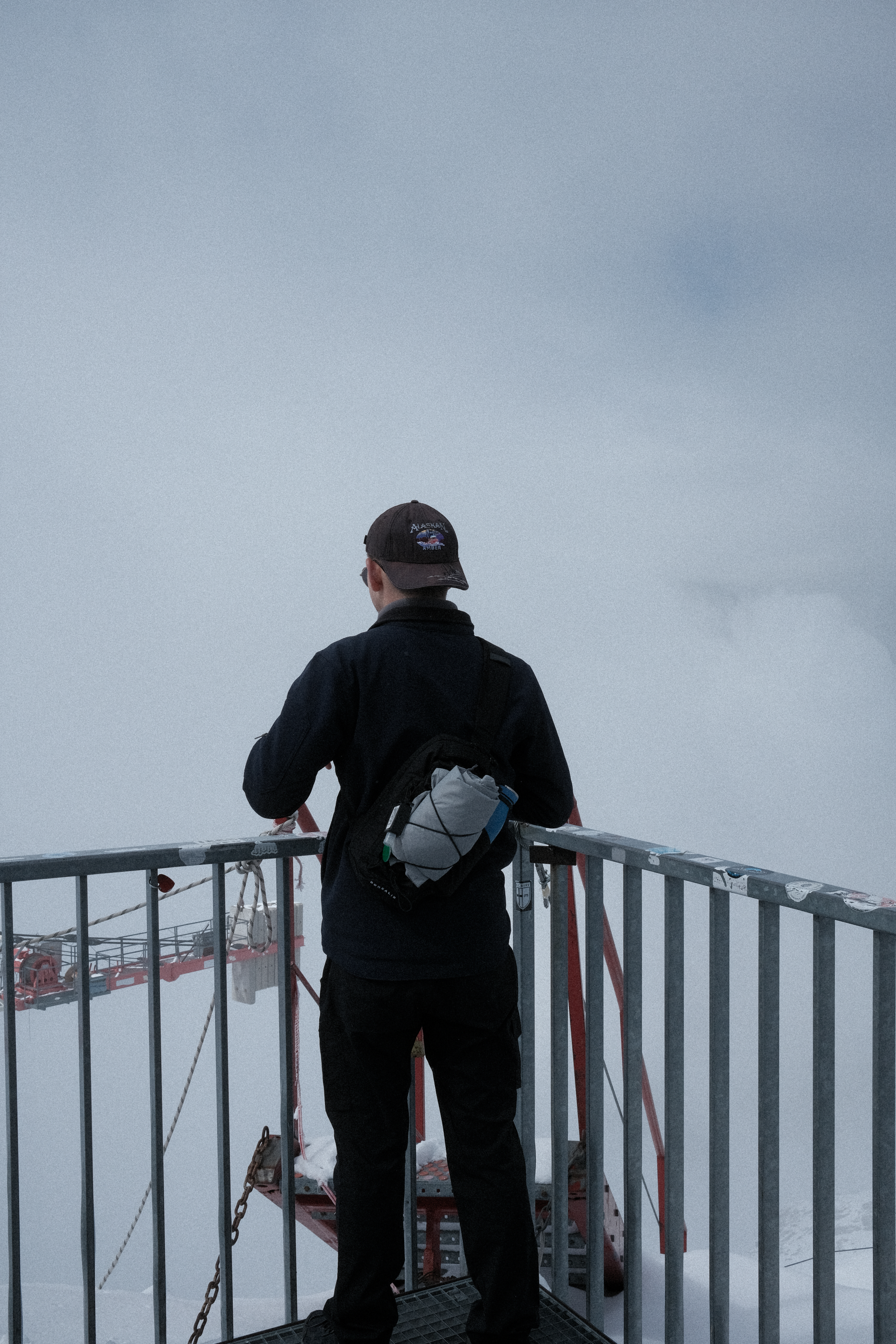 Tim facing out over the valley from the observation platform at Zermatt Glacier Paradise