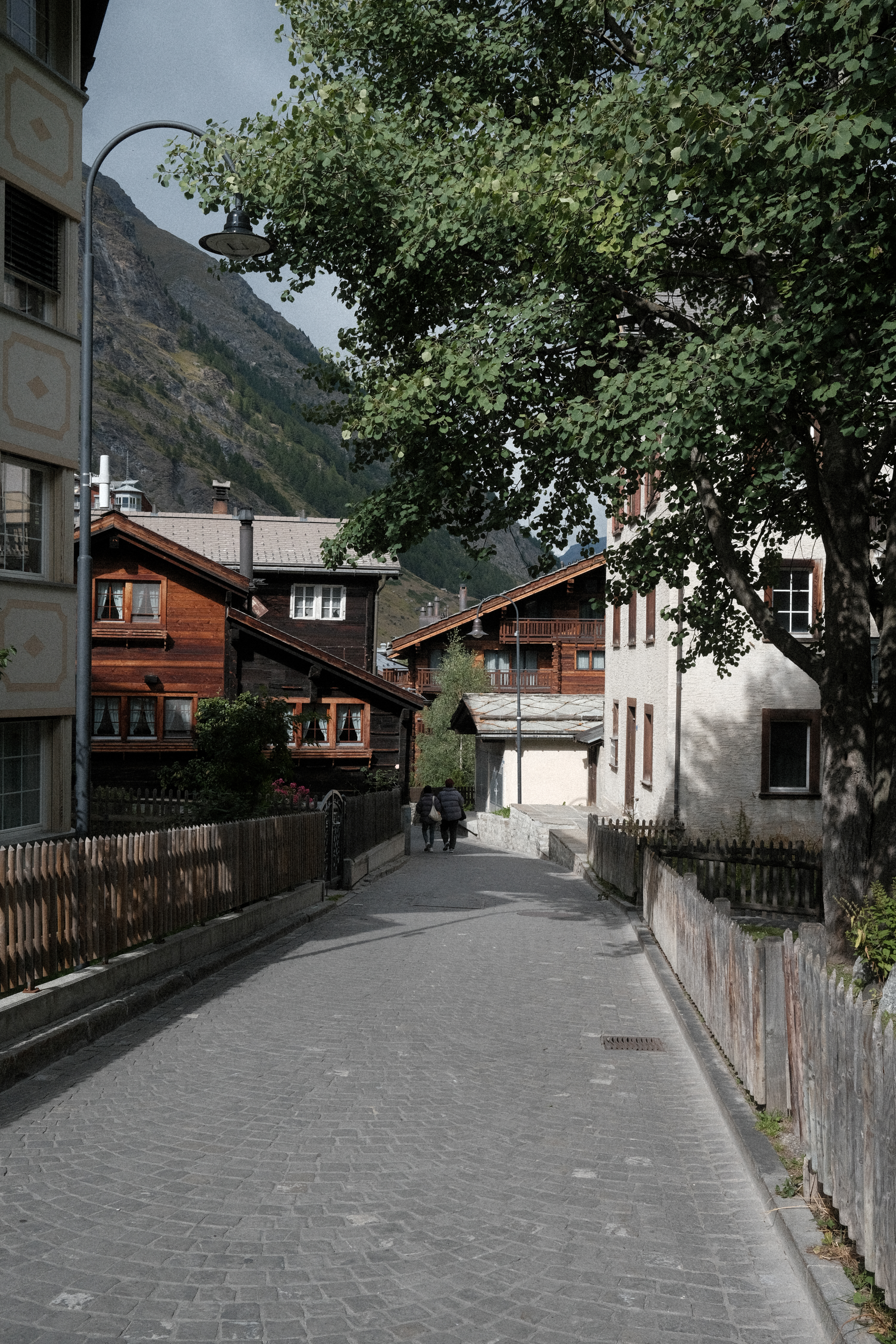 A couple walking down a side street