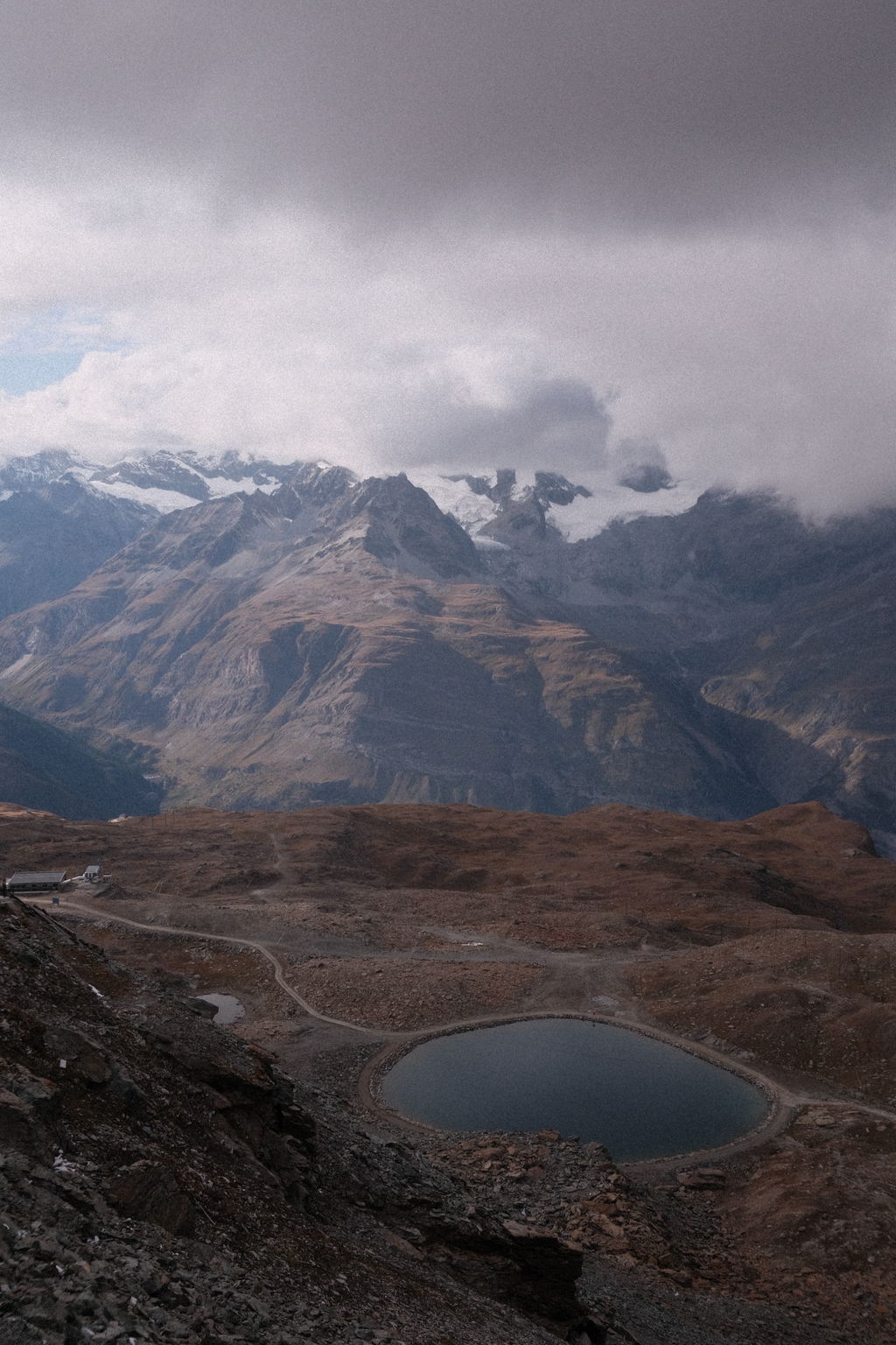 An alpine lake to the north of Gornergrat observatory with Gabelhorngletscher glacier in the background