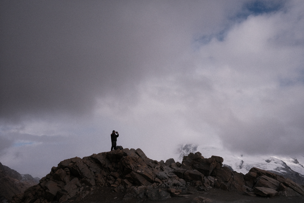 A man silhouetted against the incoming storm