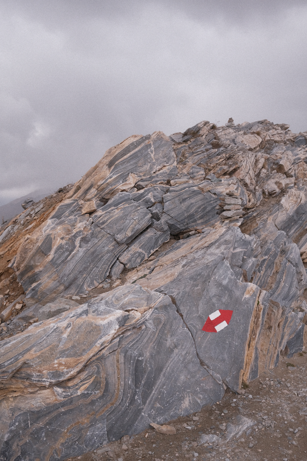 A neat rock formation near Gornergrat, with a interpeak trail marker