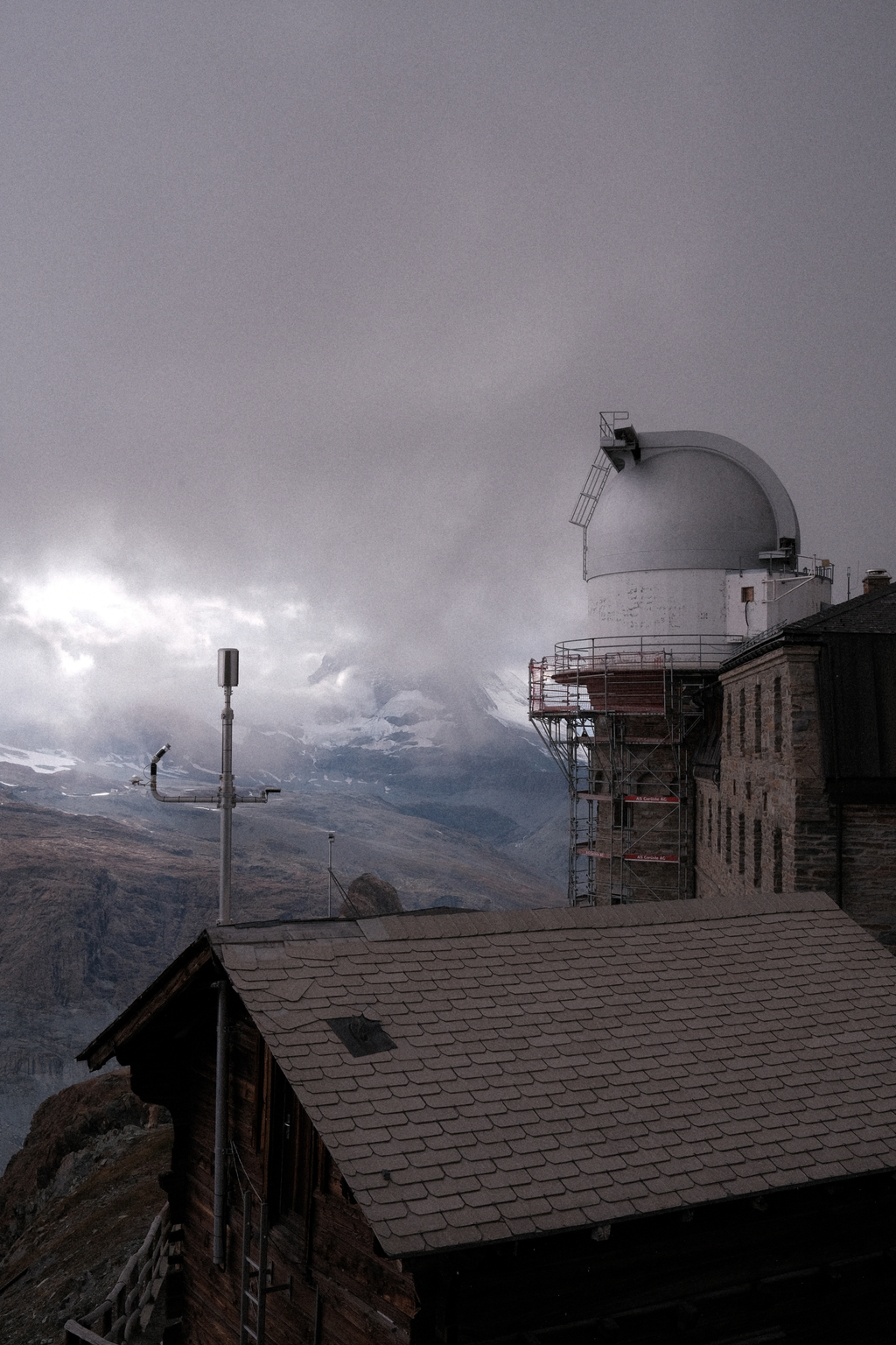 A storm decending on the Zermatt valley with the Gornergrat observatory in the foreground