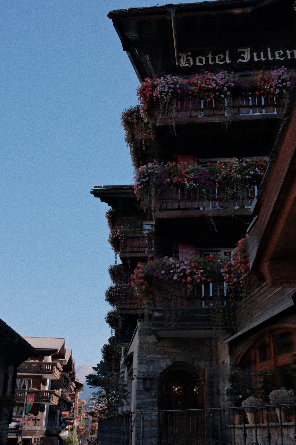 The flowered balconies of the Hotel Julen before the first morning light had reached them