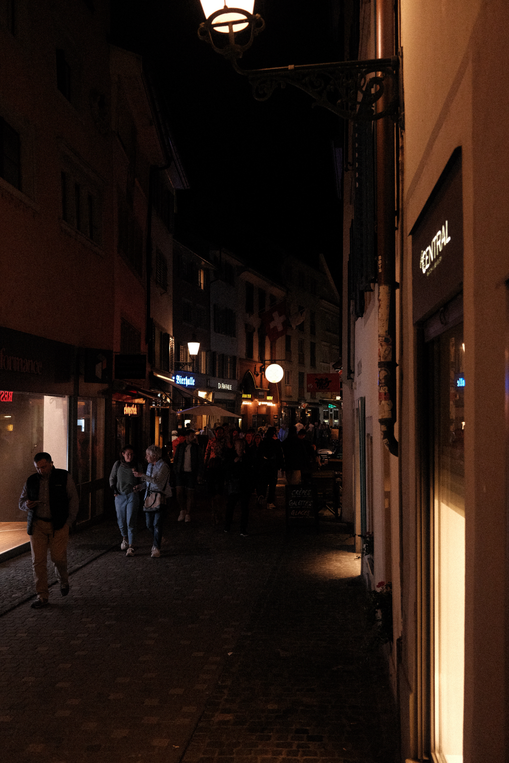 Looking down Niederdorfstrasse towards Rheinfelder Bierhalle at night