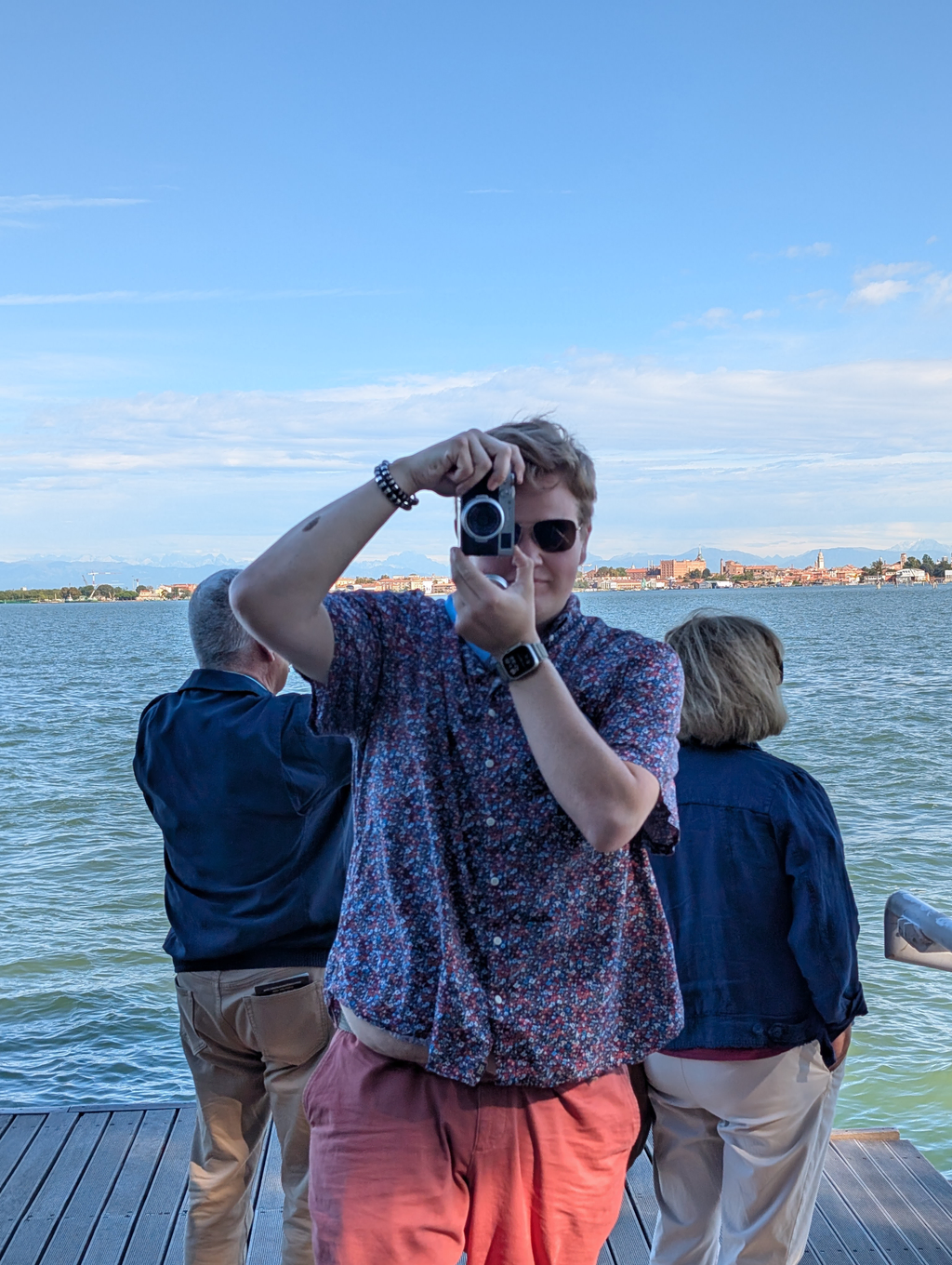 Sean standing on the docks of the JW, taking a picture