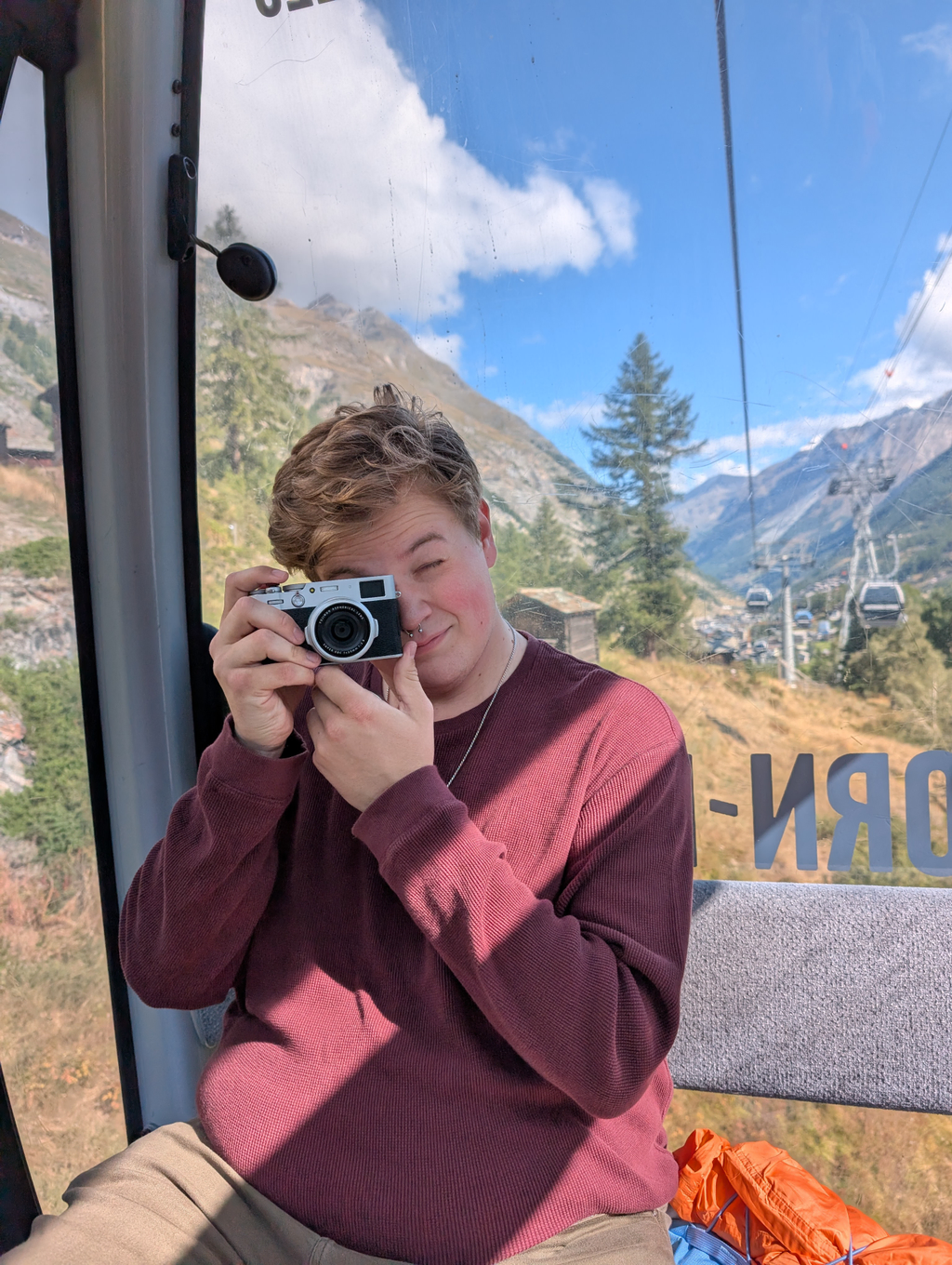 Sean taking a picture on the Gondola between Furi and Trockener Steg