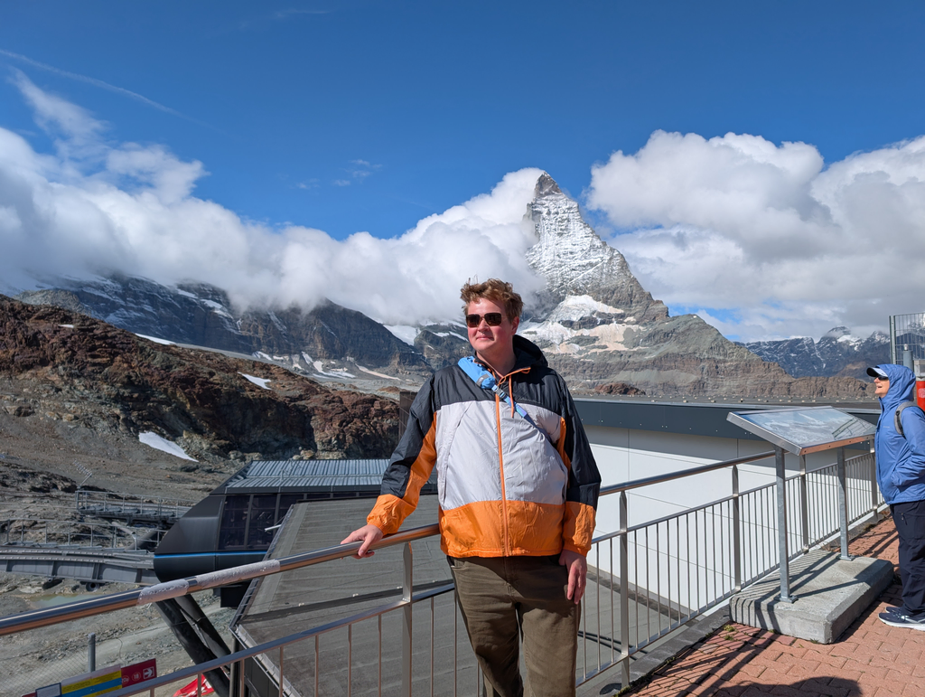 Sean on the viewing balcony of Trockener Steg with the Matternhorn